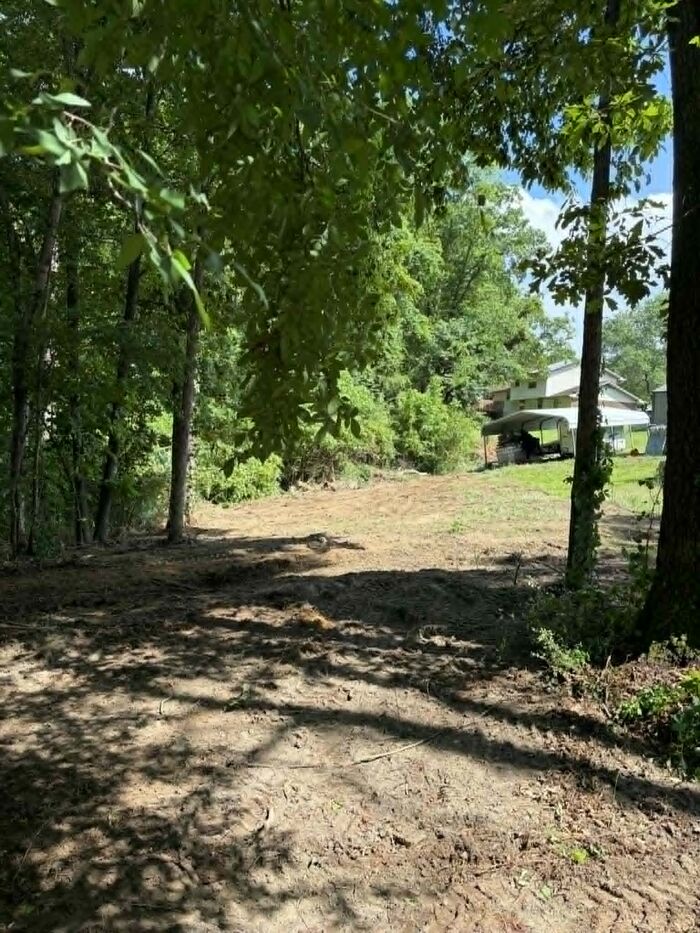 Sloped yard cleared and graded near a home