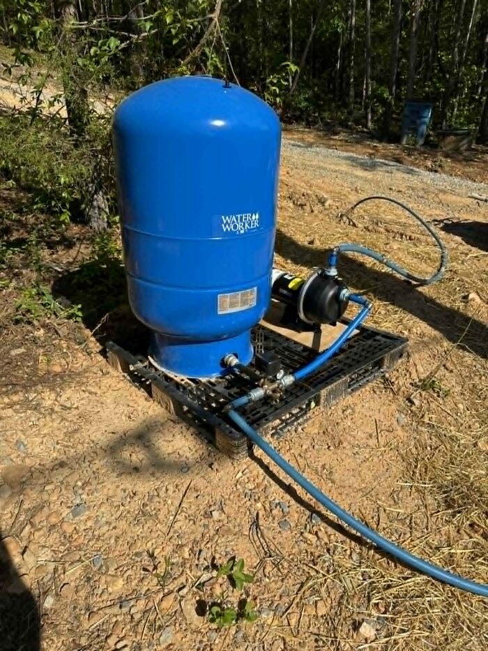 Water pressure tank and booster pump system installed and plumbed